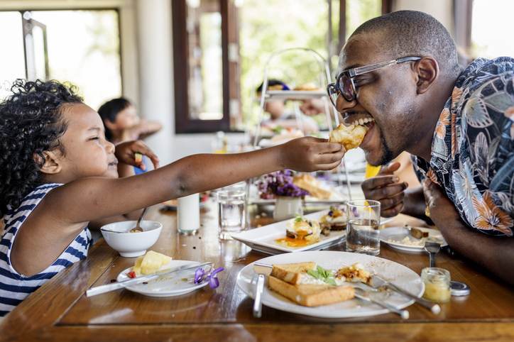 Guests having breakfast at hotel restaurant