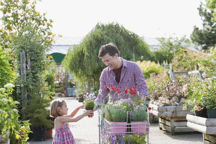 Father and daughter shopping together in nursery