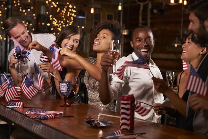 Friends celebrating July 4th at a party in a bar